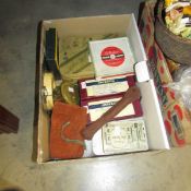 A box of fishing equipment including lures, plugs, line, flies, weights, fly reel etc.
