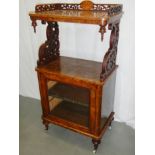 A Victorian walnut music cabinet with glass door and inlays.