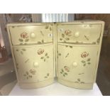 A pair of shabby chic pot cupboards.