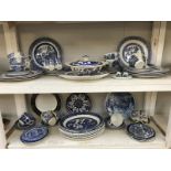 2 shelves of Blue willow blue & white dinnerware