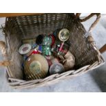 A quantity of old tins in a log basket.