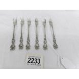 A set of 6 art nouveau sterling silver cake forks.