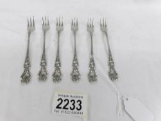 A set of 6 art nouveau sterling silver cake forks.