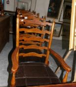 A set of oak ladder back chairs comprising 2 carvers and 4 diners.