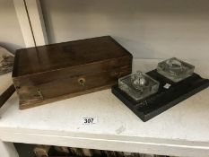 A double glass inkwell and a wooden box.