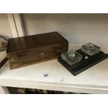 A double glass inkwell and a wooden box.