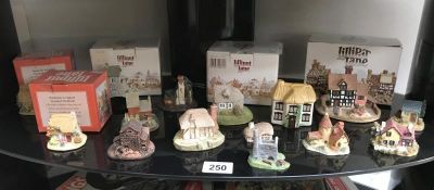 A quantity of boxed and unboxed Lilliput lane items and others including Tetley