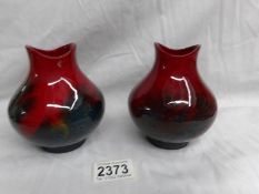 A pair of Doulton Flambe' vases, (12 cm).