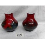 A pair of Doulton Flambe' vases, (12 cm).