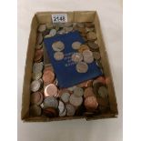 A mixed lot of UK and foreign coins.