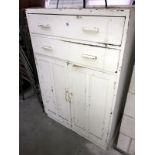 A painted pine cabinet with 2 top drawers.