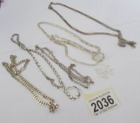 A mixed lot of silver chains etc, (approximately 70 grams).