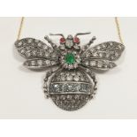 An outstanding 9ct gold 'Bee' pendant with 4 carats of diamonds, central set emerald and ruby eyes.