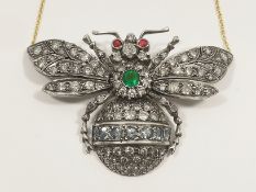 An outstanding 9ct gold 'Bee' pendant with 4 carats of diamonds, central set emerald and ruby eyes.