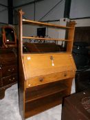 An oak arts and crafts bureau book case.