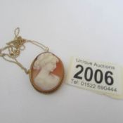 A 9ct gold shell cameo pendant/brooch of a female profile.