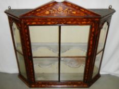 A Dutch marquetry inlaid hanging wall cabinet.