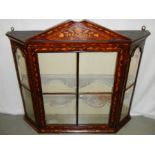 A Dutch marquetry inlaid hanging wall cabinet.