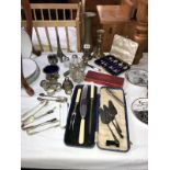 A mixed lot of silver plate including cruet set, cutlery, napkin rings etc.