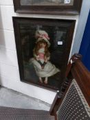 An oak framed and glazed print of a young girl.