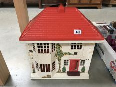 A Tri-Ang dolls house with furniture