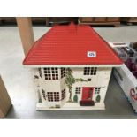 A Tri-Ang dolls house with furniture