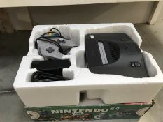 A Nintendo 64 computer console with 1 hand held controller & box