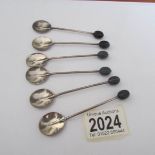 A cased set of six silver spoon with coffee bean finials.