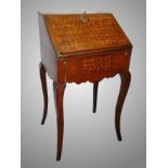 A Georgian petite ladies walnut parquetry bureau.