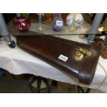 A leather gun case.