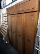 Two 3 door wardrobes with top boxes.