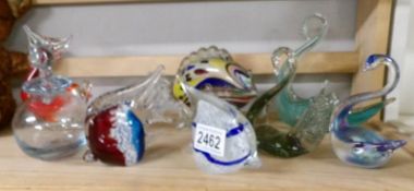 A mixed lot of coloured glass including swan dishes, fish paperweights etc.