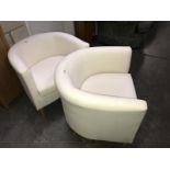 A pair of tub chairs.