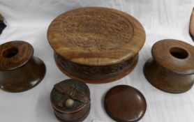 A carved wood tea box, 2 carved wood hair pots and 2 other items.