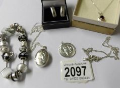 A mixed lot of silver and white metal jewellery including St.