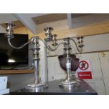 A pair of silver plate candelabra.