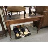 A Victorian mahogany desk with leather inset