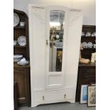 A 1930's painted oak wardrobe with bevelled mirror door.