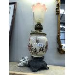 A Victorian oil lamp converted to electric (shade a/f).