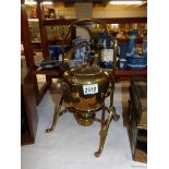 A Victorian brass kettle on stand.