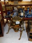 A Victorian brass kettle on stand.