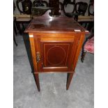 A Victorian mahogany inlaid pot cupboard.