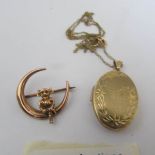 A 9ct gold locket on a 9ct gold chain together with a Lincoln Imp brooch (5 grams).
