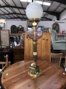A brass table lamp in the form of an oil lamp.