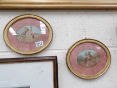 A pair of oval framed and glazed watercolour studies of horses.