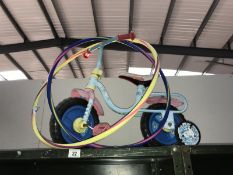 A child's bike and 2 hula hoops