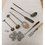 A mixed lot including plated nurses buckle, 19th century ladle, spoons etc.