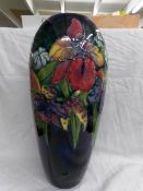 A tall Moorcroft vase, (38 cm).
