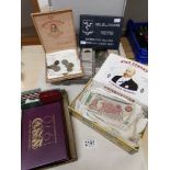 A collection of British and International coins and banknotes including year sets,