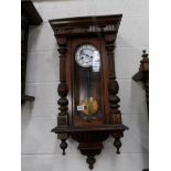 A Victorian mahogany 8 day wall clock, in working order.